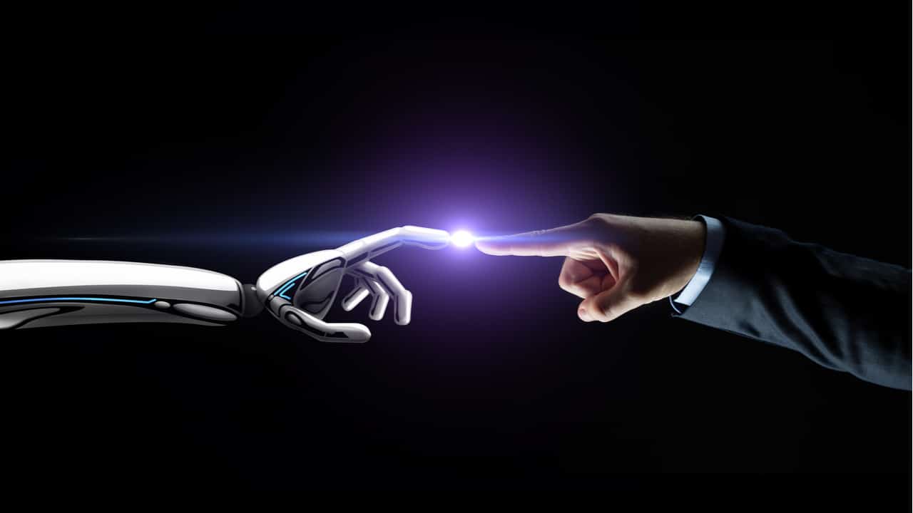 https://online.york.ac.uk/wp-content/uploads/2022/03/Robot-hand-and-human-hand-touching-a-dot-of-light-in-the-middle-of-them.jpg